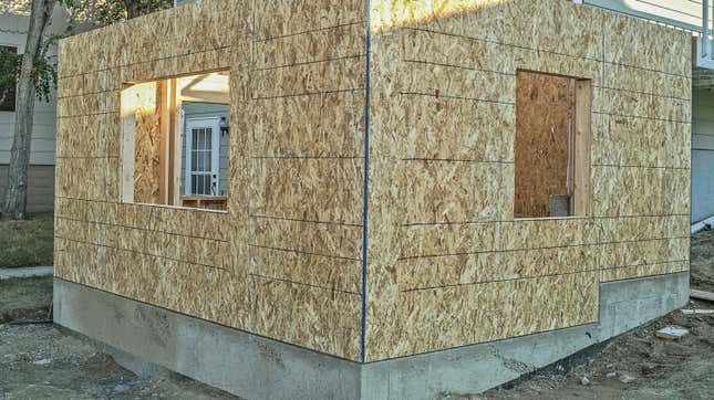 Foundation and first floor of home addition framed and covered with osb (oriented strand board)