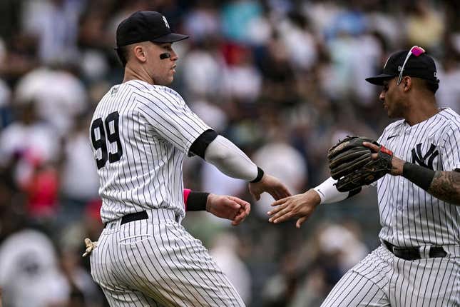 May 13, 2023; Bronx, New York, USA; New York Yankees center fielder Aaron Judge (99) celebrates with teammates after defeating the Tampa Bay Rays 9-8 at Yankee Stadium.