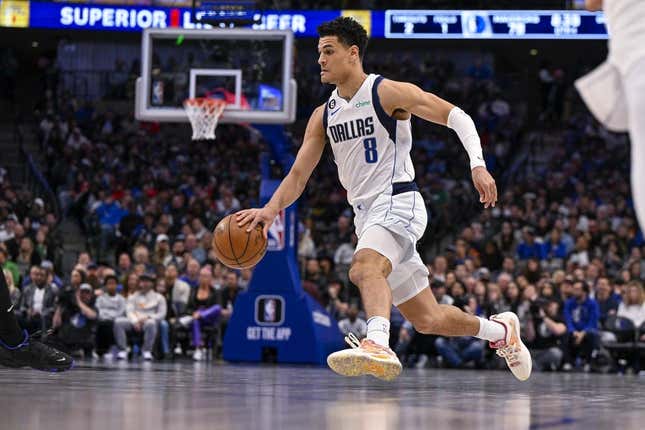 Mar 13, 2023; Dallas, Texas, USA; Dallas Mavericks guard Josh Green (8) brings the ball up court against the Memphis Grizzlies during the second half at the American Airlines Center.