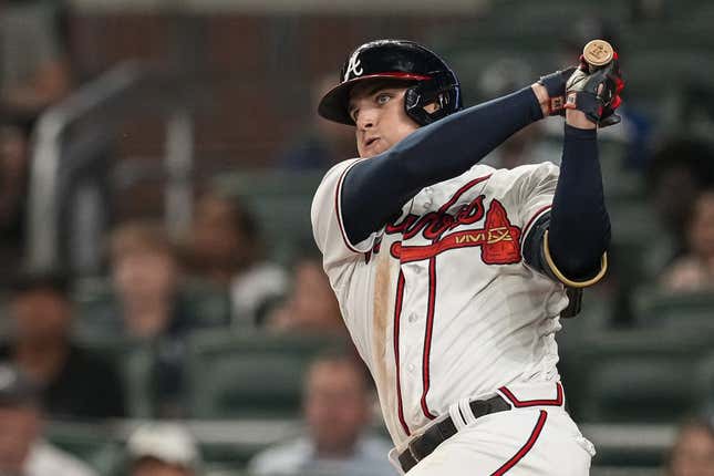 May 24, 2023; Cumberland, Georgia, USA; Atlanta Braves third baseman Austin Riley (27) hits a double against the Los Angeles Dodgers during the ninth inning at Truist Park.
