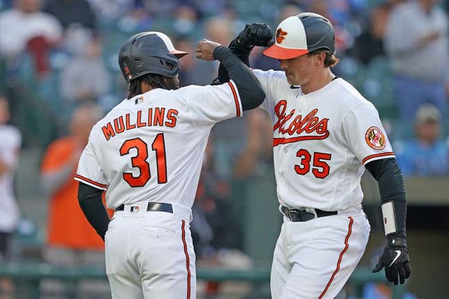 May 9, 2023; Baltimore, Maryland, USA; Baltimore Orioles catcher Adley Rutschman (35) greeted by outfielder Cedric Mullins (31) who scored on his two run home run in the third inning against the Tampa Bay Rays at Oriole Park at Camden Yards.