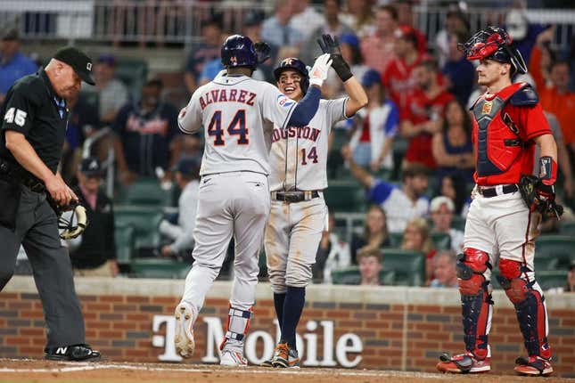 Apr 21, 2023; Atlanta, Georgia, USA; Houston Astros left fielder Yordan Alvarez (44) celebrates after a home run with second baseman Mauricio Dubon (14) against the Atlanta Braves in the ninth inning at Truist Park.