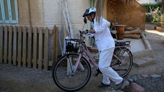 Dorothee Hildebrandt, 72, sets out from her host’s apartment to ride her bike to the U.N. climate summit COP27 in Sharm el-Sheikh, Egypt, Saturday, Nov. 12, 2022.