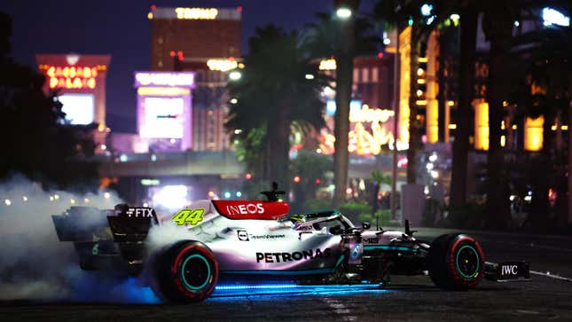 UK's Lewis Hamilton and Mercedes drive on track during the Formula 1 Las Vegas Grand Prix 2023 launch party on November 5, 2022 on the Las Vegas Strip in Las Vegas, Nevada.