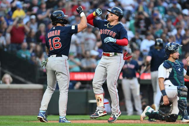 Aug 1, 2023; Seattle, Washington, USA; Boston Red Sox center fielder Jarren Duran (16) and designated hitter Alex Verdugo (99) celebrate after Verdugo hit a two run home run against the Seattle Mariners during the fifth inning at T-Mobile Park.