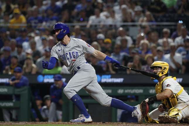 Jun 19, 2023; Pittsburgh, Pennsylvania, USA;  Chicago Cubs shortstop Dansby Swanson (7) hits an infield RBI single against the Pittsburgh Pirates during the seventh inning at PNC Park.