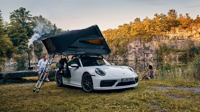 A photo of a Porsche 911 with a roof top tent fitted. 