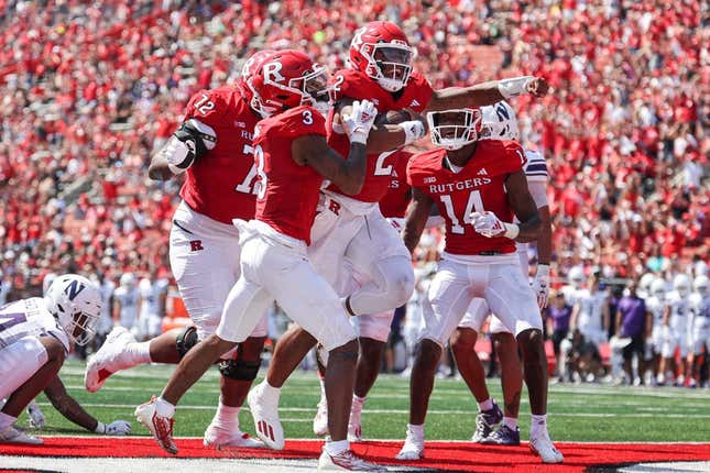 Sep 3, 2023; Piscataway, New Jersey, USA; Rutgers Scarlet Knights quarterback Gavin Wimsatt (2) celebrates his touchdown with teammates during the first half against the Northwestern Wildcats at SHI Stadium.