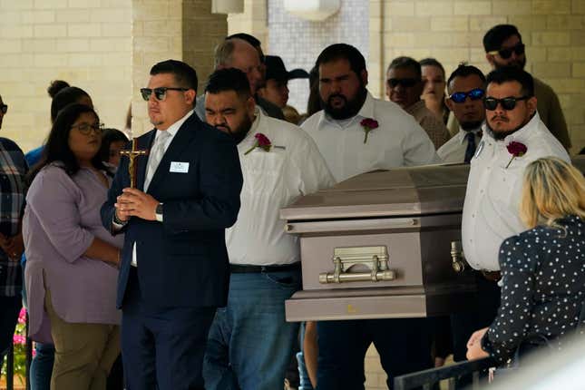 Pallbearers carry the casket of Amerie Jo Garza following funeral services at Sacred Heart Catholic Church, Tuesday, May 31, 2022, in Uvalde, Texas. Garza was killed in last week’s elementary school shooting.