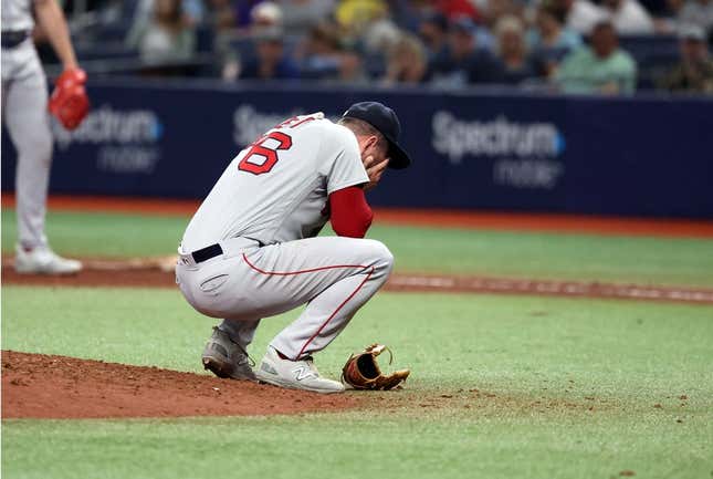 Apr 12, 2023; St. Petersburg, Florida, USA; Boston Red Sox relief pitcher Zack Kelly (76) reacts after a pitch against the Tampa Bay Rays during the fifth inning at Tropicana Field.