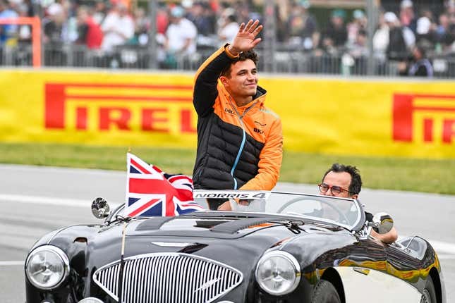 Jun 18, 2023; Montreal, Quebec, CAN; McLaren driver Lando Norris (GBR) parades and salutes the crowd before the Canadian Grand Prix at Circuit Gilles Villeneuve.