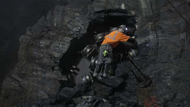 A construction worker, also known as a sandhog, climbs down from a hole created by a tunnel boring machine, Thursday, Sept. 22, 2011 in New York. The Metropolitan Transportation Authority completed tunneling Thursday for the first phase of the Second Avenue Subway after borer reached the Lexington Avenue-63rd Street station, breaking into the existing tunnel. The completion of tunneling marks a major milestone in the $4.45 billion project that will provide service from 96th Street to 63rd Street as an extension of the Q train. (AP Photo/Mary Altaffer