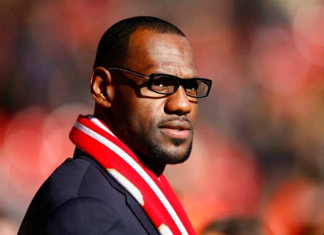 US and Miami Heat basketball player LeBron James looks on before the English Premier League soccer match between Liverpool and Manchester United at Anfield, Liverpool, England, Saturday Oct. 15, 2011.