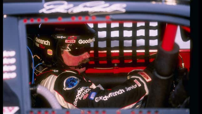 Dale Earnhardt sits behind the wheel during the Exide Batteries 400 at the Richmond International Raceway in Richmond, Virginia, 1997