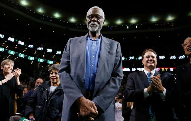 Boston Celtics legend Bill Russell stands court side during a tribute in his honor in the second quarter of an NBA basketball game against the Milwaukee Bucks in Boston, Nov. 1, 2013. The NBA great Bill Russell has died at age 88. His family said on social media that Russell died on Sunday, July 31, 2022. Russell anchored a Boston Celtics dynasty that won 11 titles in 13 years.
