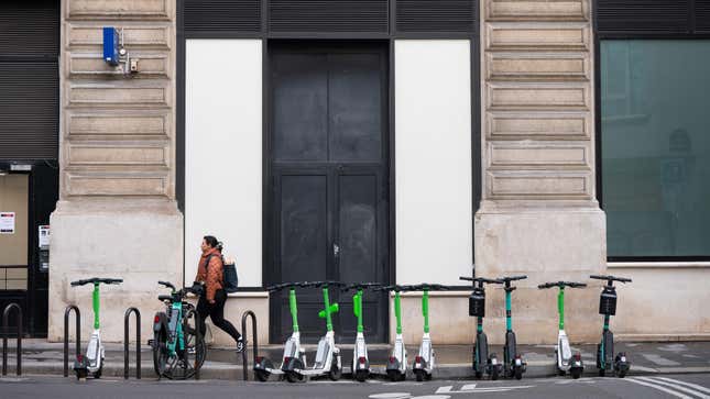 Public hire electric scooters, operated by Tier Mobility SE and Lime Technologies AB, parked at the roadside in Paris, France, on Friday, March 31, 2023. Residents will decide in a referendum on Sunday whether to oust shared electric scooters from the city, in what could be a global test for micromobility regulation. 
