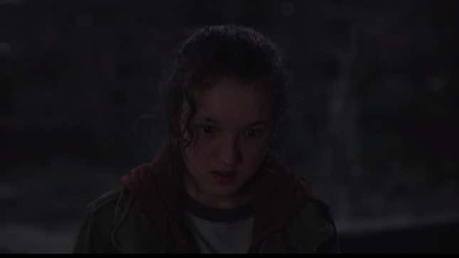 Ellie staring at something offscreen, fixated, in a scene from HBO's The Last of Us.