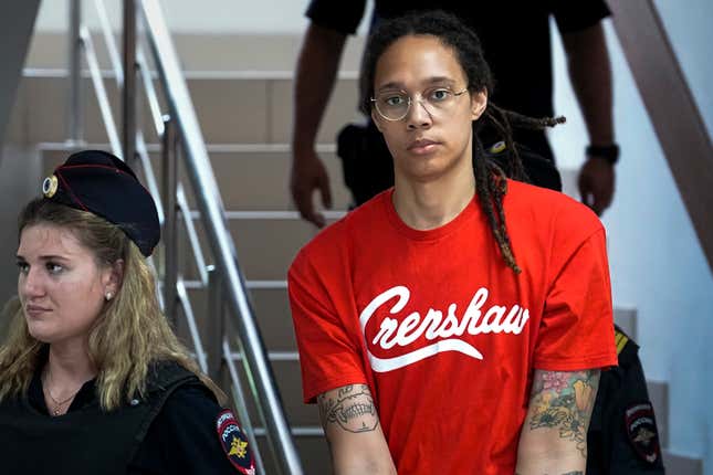 WNBA star and two-time Olympic gold medalist Brittney Griner is escorted to a courtroom for a hearing, in Khimki just outside Moscow, Russia, Thursday, July 7, 2022.