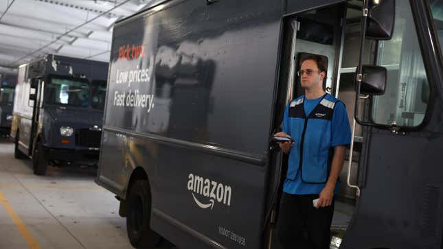 An Amazon driver waits to fill his truck at an Amazon delivery station on November 28, 2022 in Alpharetta, Georgia.