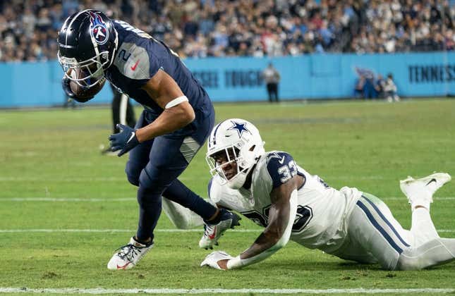 Tennessee Titans wide receiver Robert Woods (2) drives into the end zone for a touchdown past Dallas Cowboys linebacker Damone Clark (33) during the third quarter at Nissan Stadium Thursday, Dec. 29, 2022, in Nashville, Tenn.

Nfl Dallas Cowboys At Tennessee Titans