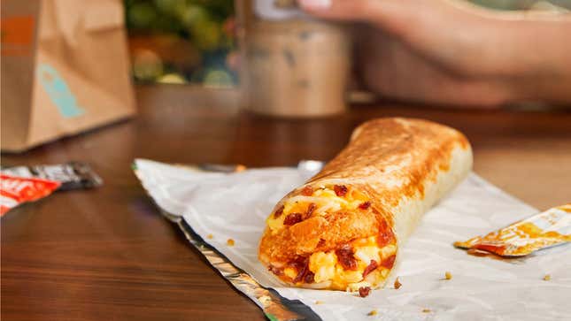 Taco Bell breakfast burrito on wooden table