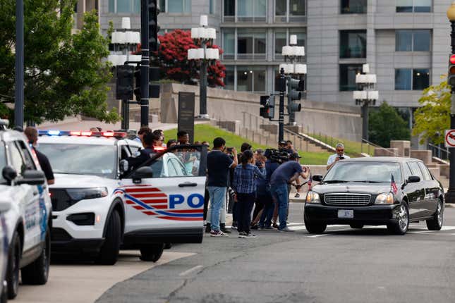 WASHINGTON, DC - AUGUST 03: Journalists film and take pictures of supporters of former U.S. President Donald Trump in a limousine near the E. Barrett Prettyman United States Courthouse