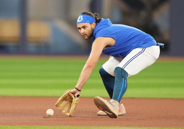 Jul 31, 2023; Toronto, Ontario, CAN; Toronto Blue Jays shortstop Bo Bichette (11) fields balls during batting practice before a game against the Baltimore Orioles at Rogers Centre.