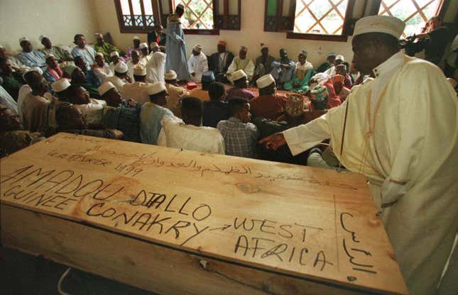 Guinean mourners hold an Islamic ceremony by the pine casket of Amadou Diallo at the main mosque in Conakry, Guinea Feb. 16, 1999. Diallo was gunned down Feb. 4, 1999 in New York City by four plainclothes police officers.