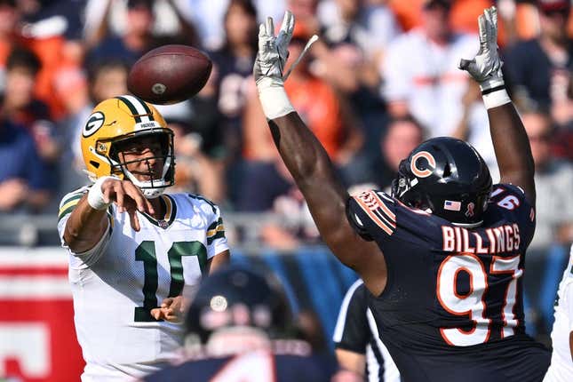 Sep 10, 2023; Chicago, Illinois, USA;  Green Bay Packers quarterback Jordan Love (10) passes over the defense of Chicago Bears defensive lineman Andrew Billings (97) in the first half at Soldier Field.