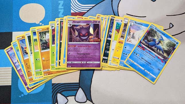 Some Lost Origin Pokemon cards on a Snorlax playmat.