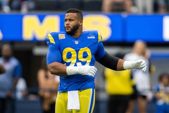 Los Angeles Rams defensive tackle Aaron Donald (99) warms up before an NFL football game against the Carolina Panthers Sunday, Oct. 16, 2022, in Inglewood, Calif.