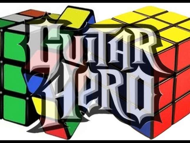 Playing Guitar Hero On Expert While Solving Two Rubik's Cubes
