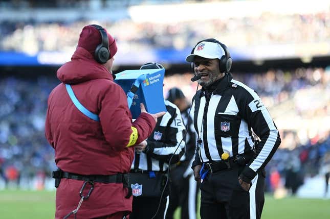 Nov 20, 2022; Baltimore, Maryland, USA; referee Jerome Boger (23) conducts instant review during the second half of the game between the Baltimore Ravens and the Carolina Panthers  at M&amp;amp;T Bank Stadium.