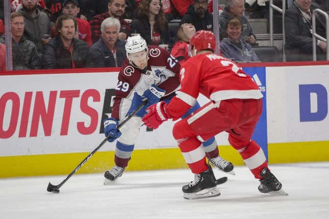 Mar 18, 2023; Detroit, Michigan, USA; Colorado Avalanche center Nathan MacKinnon (29) handles the puck during the first period at Little Caesars Arena.