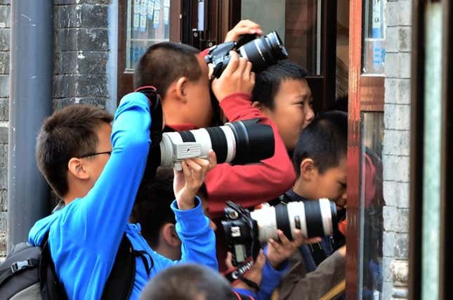 boys taking photos