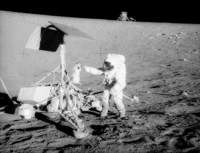 An Apollo 12 astronaut visiting Surveyor 3.