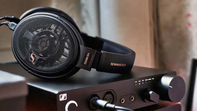 The Sennheiser HD 660S2 headphones sitting atop a headphone amplifier.