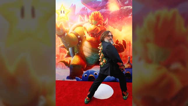 Jack Black poses in front of a poster of Bowser at the Super Mario Bros. special screening. 