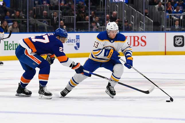 Mar 7, 2023; Elmont, New York, USA;  Buffalo Sabres left wing Jeff Skinner (53) skates with the puck defended by New York Islanders left wing Anders Lee (27) during the first period at UBS Arena.