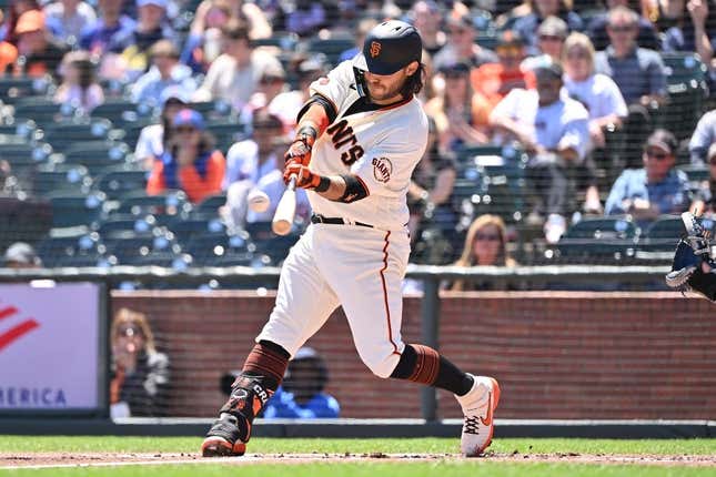 Apr 22, 2023; San Francisco, California, USA; San Francisco Giants infielder Brandon Crawford (35) hits a three run home run against New York Mets starting pitcher David Peterson (23) during the first inning at Oracle Park.