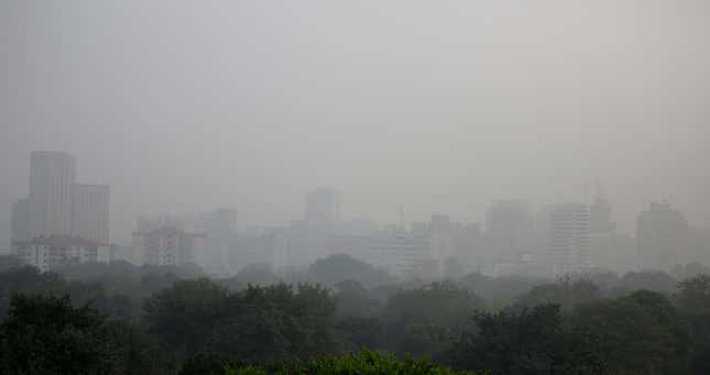 Smog envelops the skyline at noon in New Delhi on Nov. 07.