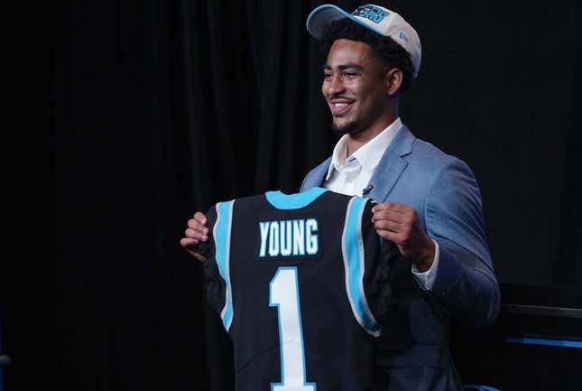 Apr 28, 2023; Charlotte, NC, USA; Bryce Young holds up a jersey depicting his draft position at Bank of America Stadium.
