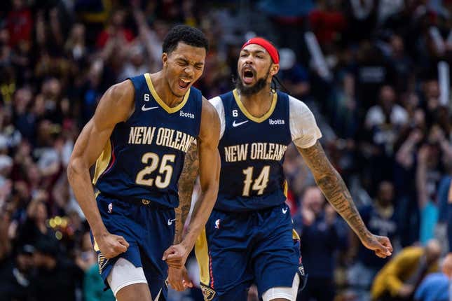 Apr 5, 2023; New Orleans, Louisiana, USA;  New Orleans Pelicans guard Trey Murphy III (25) reacts to making a three point basket with forward Brandon Ingram (14) against the Memphis Grizzlies during the second half at Smoothie King Center.