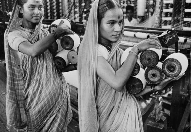 Women working in a textile mill in colonial-era Bombay.
