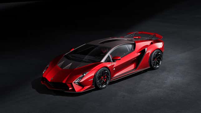 The red, one-off Lamborghini Invencible coupe is parked in the studio against a black background.