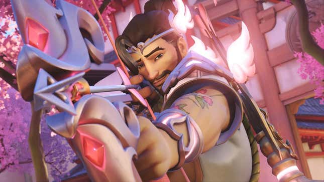 Hanzo is seen wearing a Cupid skin with his bow strung and a smirk on his face.