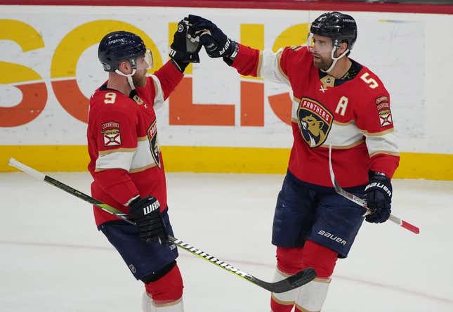 Mar 16, 2023; Sunrise, Florida, USA; Florida Panthers defenseman Aaron Ekblad (5) celebrates a goal with center Sam Bennett (9) in the second period against the Montreal Canadiens at FLA Live Arena.