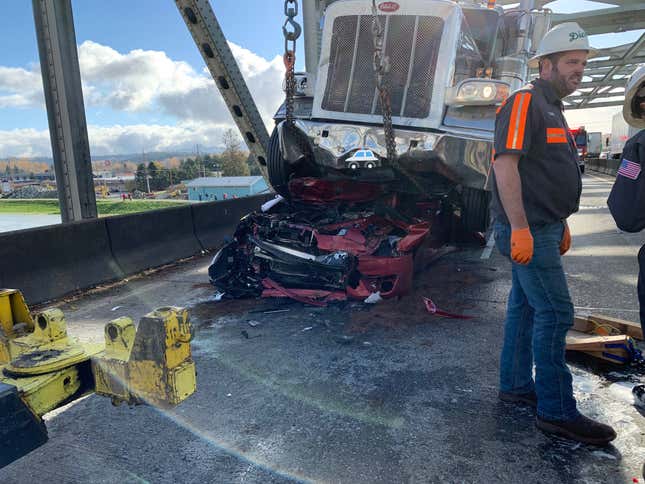 Image for article titled Nissan Altima Driver Survives Absurd Crash After Her Car Literally Folds Onto Itself Under A Big Rig