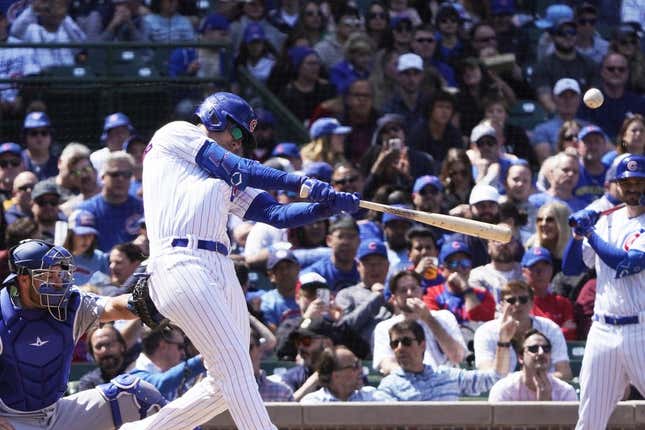 Apr 21, 2023; Chicago, Illinois, USA; Chicago Cubs center fielder Cody Bellinger (24) hits a home run against the Los Angeles Dodgers during the third inning at Wrigley Field.