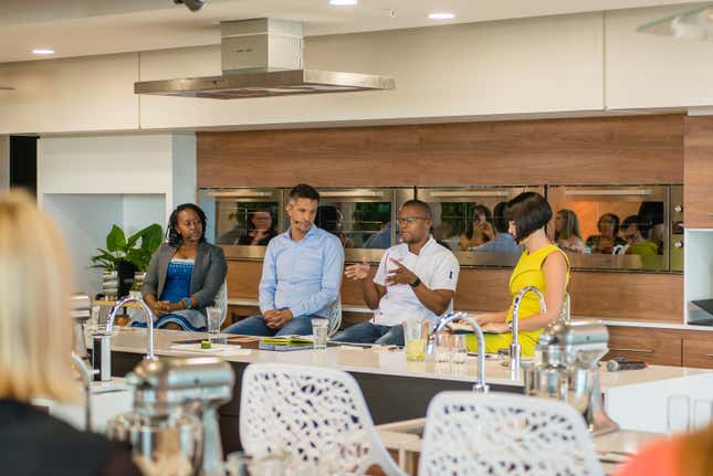Nompumelelo Mqwebu, far left, and Miles Khubeka, second from right, speak at a panel in Johannesburg on healthy South African meals.